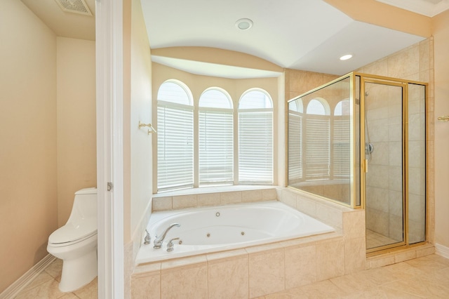 bathroom featuring a shower stall, toilet, a tub with jets, and tile patterned floors