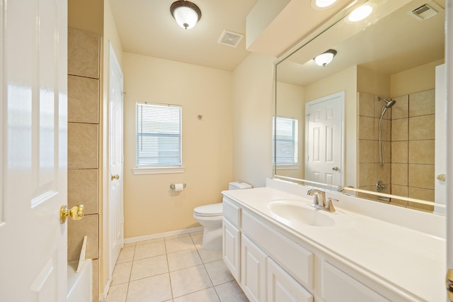 bathroom featuring tile patterned floors, visible vents, and a wealth of natural light