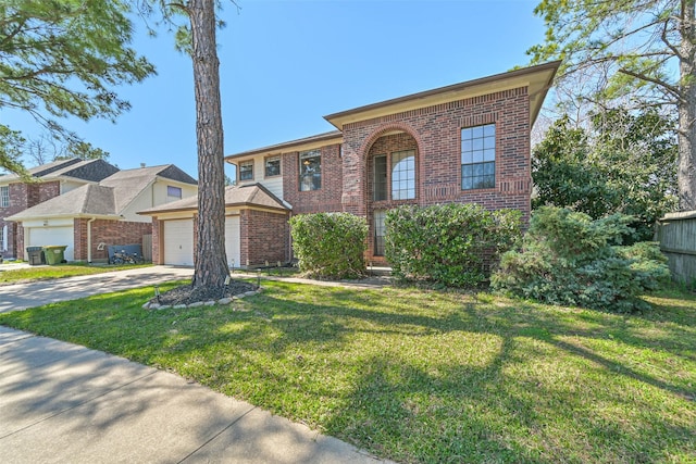 view of front of home featuring brick siding, driveway, a front lawn, and a garage