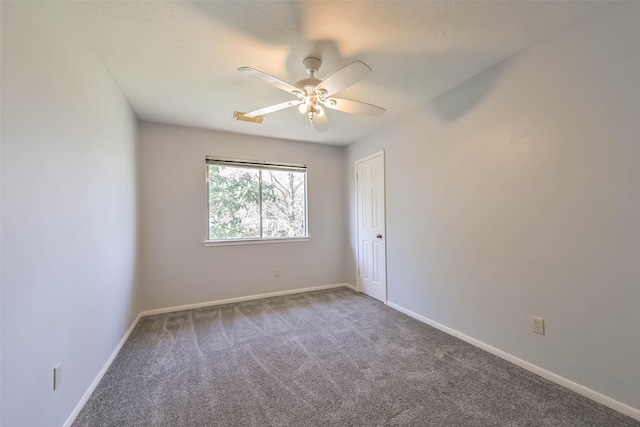 unfurnished room featuring carpet flooring, ceiling fan, and baseboards