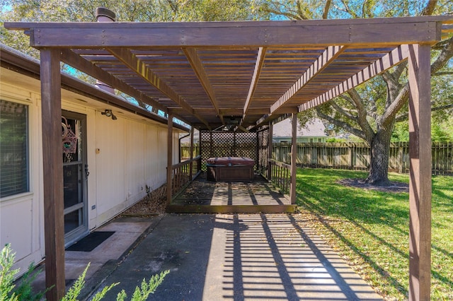 view of patio / terrace featuring a wooden deck, fence, a pergola, and a hot tub