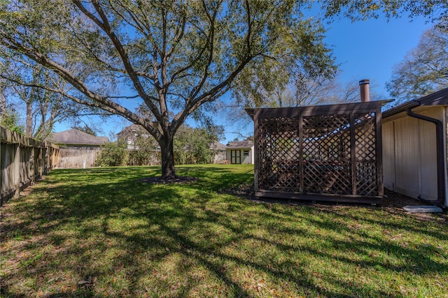 view of yard featuring a fenced backyard and a pergola