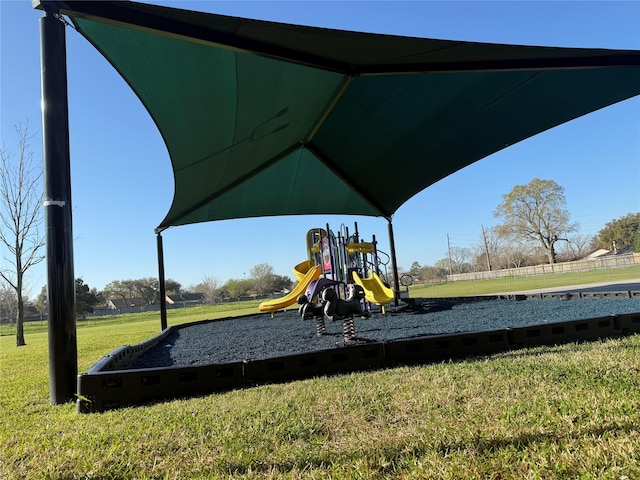 community play area with a lawn