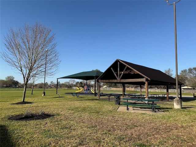 view of property's community featuring a gazebo, a yard, and playground community