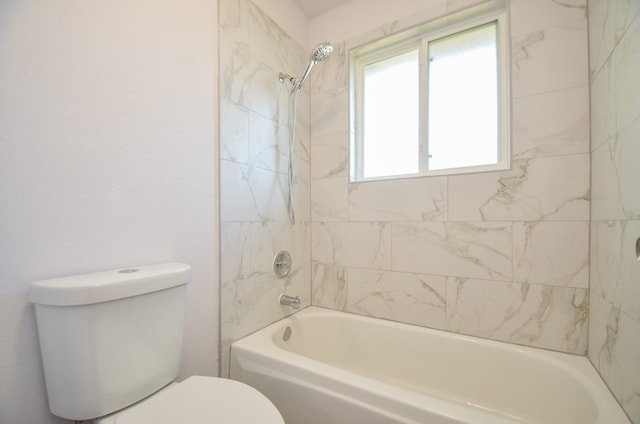 bathroom with toilet and  shower combination