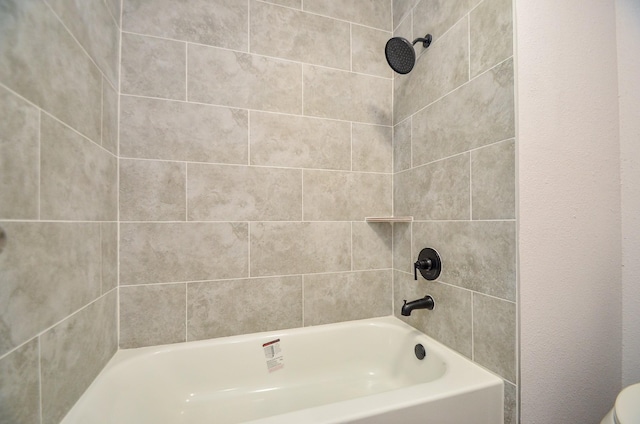 bathroom featuring  shower combination and toilet