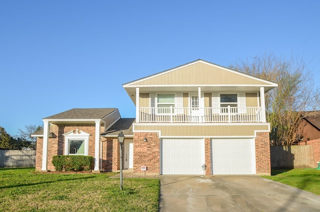 view of front of home featuring brick siding, concrete driveway, a front yard, and fence