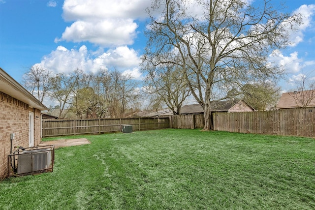 view of yard with a fenced backyard