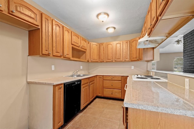 kitchen with light countertops, black dishwasher, light tile patterned flooring, and a sink