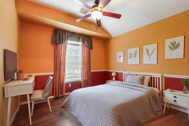 bedroom featuring wood finished floors, visible vents, baseboards, ceiling fan, and vaulted ceiling