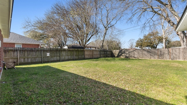 view of yard featuring a fenced backyard