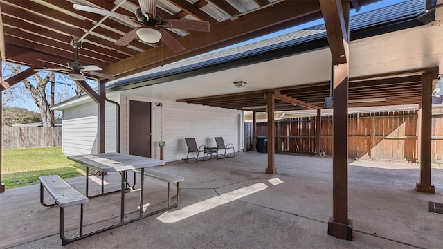 view of patio / terrace with fence and ceiling fan