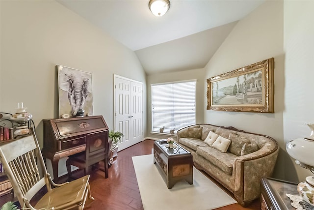 sitting room featuring lofted ceiling and dark wood-type flooring