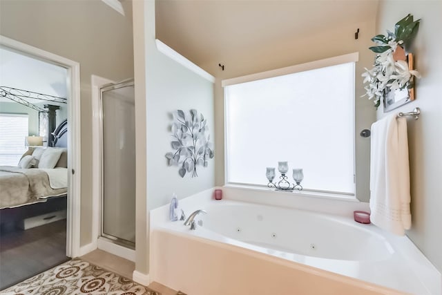 ensuite bathroom with a stall shower, ensuite bath, a whirlpool tub, and tile patterned floors