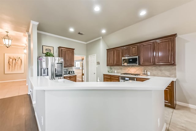 kitchen featuring tasteful backsplash, visible vents, light countertops, recessed lighting, and stainless steel appliances