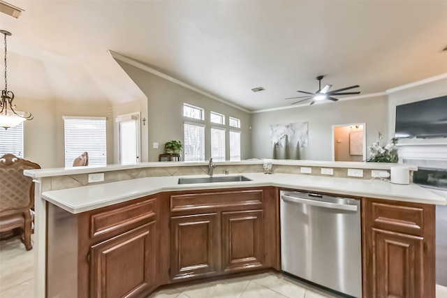 kitchen with a sink, dishwasher, open floor plan, and light countertops