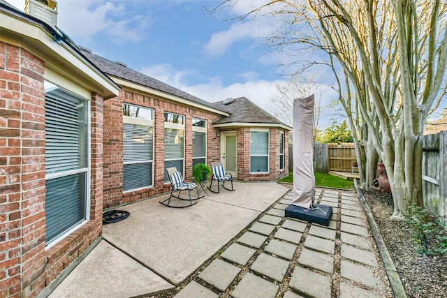 view of patio featuring fence