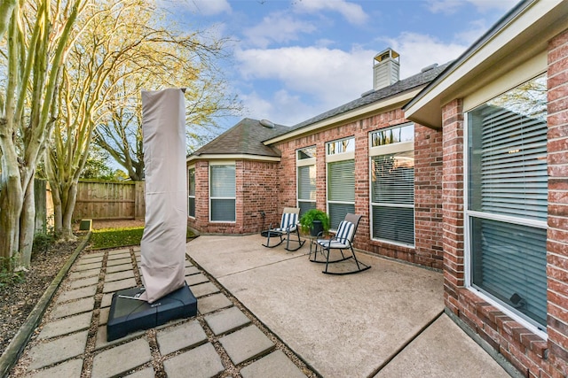 view of patio with fence