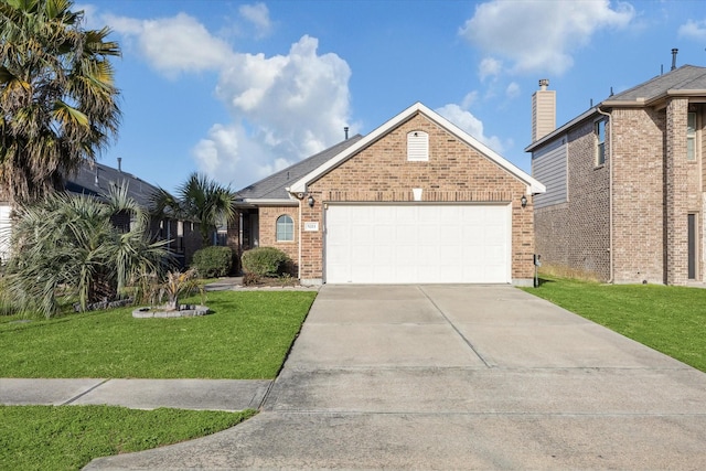 view of front of property with a garage, driveway, brick siding, and a front yard