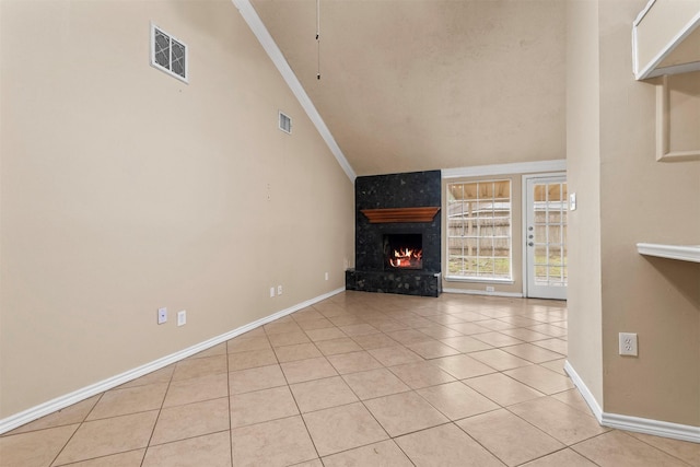 unfurnished living room with light tile patterned floors, visible vents, ornamental molding, and a fireplace