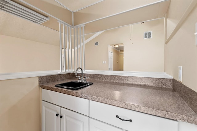 bathroom featuring visible vents and vanity