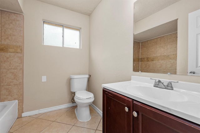 full bath featuring tile patterned flooring, baseboards, toilet, vanity, and a textured ceiling