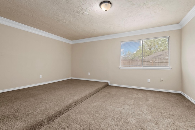 carpeted spare room with a textured ceiling, crown molding, and baseboards