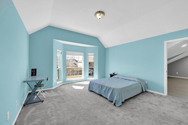 22106 Stonebriar Ln, Richmond, TX 77469 - bedroom with baseboards, vaulted ceiling, and carpet