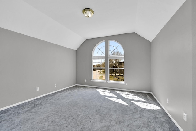 bonus room featuring vaulted ceiling, carpet flooring, and baseboards