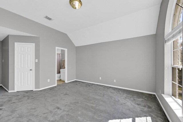 22106 Stonebriar Ln, Richmond, TX 77469 - unfurnished bedroom with baseboards, vaulted ceiling, visible vents, and carpet floors