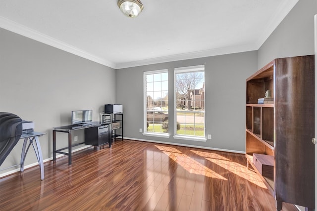 office area with crown molding, wood finished floors, and baseboards