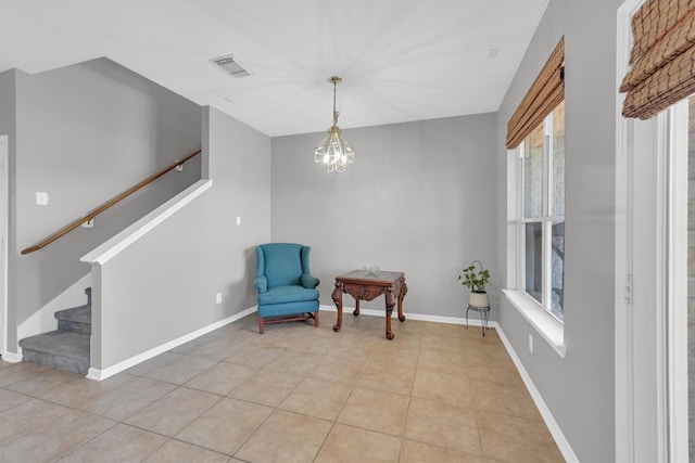 sitting room featuring visible vents, baseboards, stairway, light tile patterned floors, and an inviting chandelier