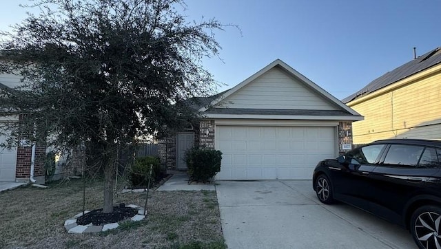 view of front of property with an attached garage and driveway