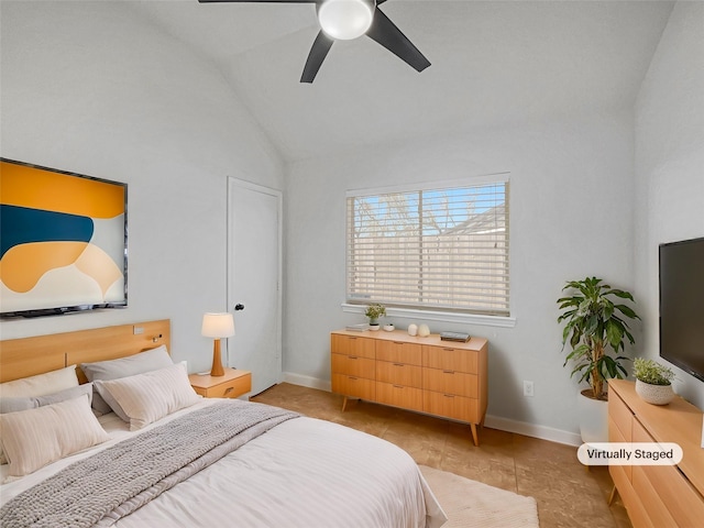 bedroom featuring vaulted ceiling, light tile patterned floors, a ceiling fan, and baseboards