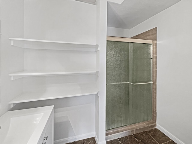 full bath featuring a shower stall and vanity