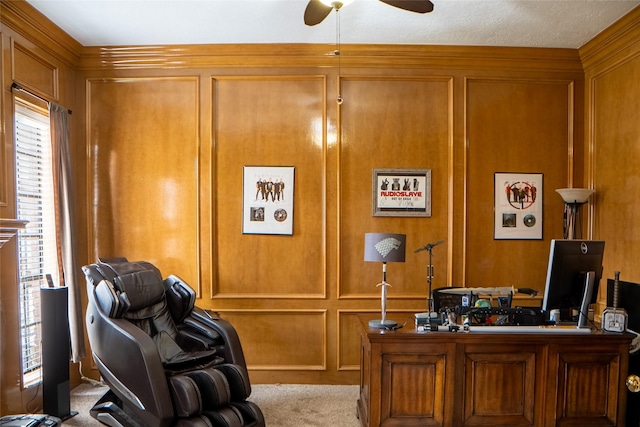 office space featuring a decorative wall and a ceiling fan