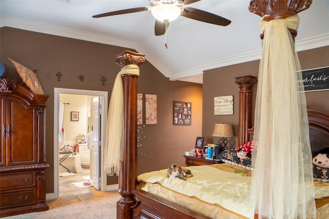 bedroom featuring light carpet, lofted ceiling, ornamental molding, and ensuite bathroom