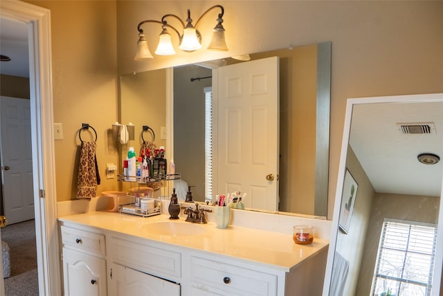 bathroom featuring vanity and visible vents