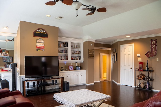 living room with dark wood-type flooring, crown molding, baseboards, and ceiling fan