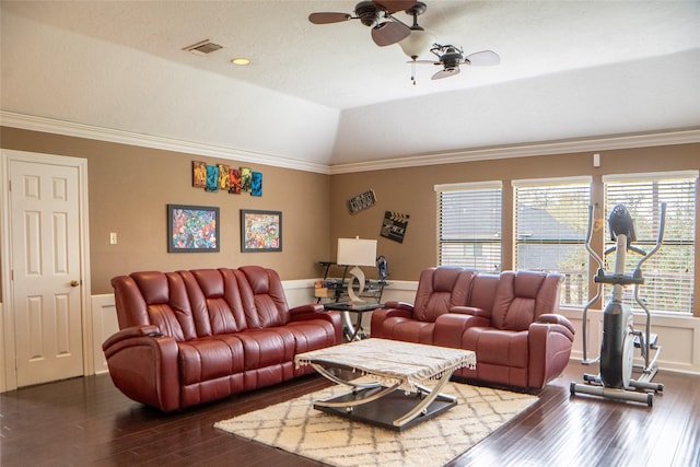 living area with visible vents, ceiling fan, vaulted ceiling, ornamental molding, and wood finished floors