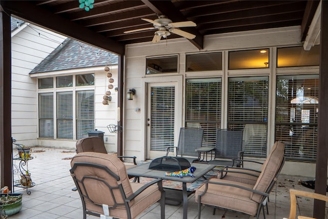 view of patio featuring outdoor dining space and a ceiling fan