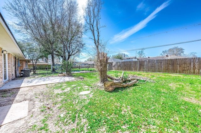 view of yard with cooling unit, a patio, and fence