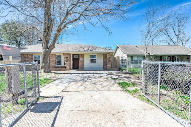 single story home with driveway, a gate, fence, roof with shingles, and brick siding