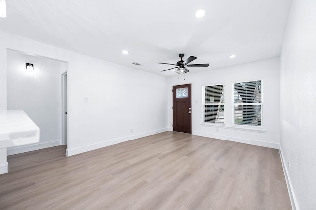 foyer entrance with recessed lighting, visible vents, baseboards, and light wood-style flooring