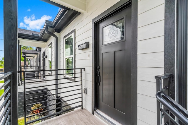 entrance to property featuring a balcony