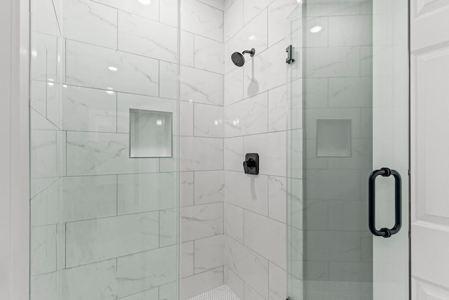 bathroom with a shower stall