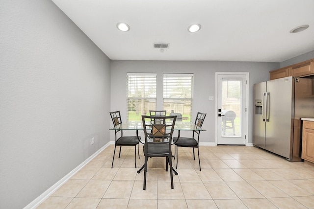 dining room with light tile patterned floors, visible vents, recessed lighting, and baseboards