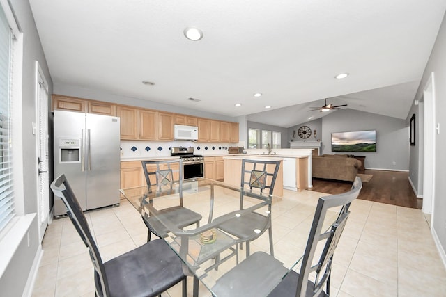 dining space featuring recessed lighting, light tile patterned floors, baseboards, ceiling fan, and vaulted ceiling