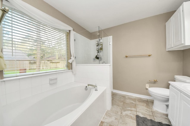 full bath featuring vanity, a bath, baseboards, a walk in shower, and toilet