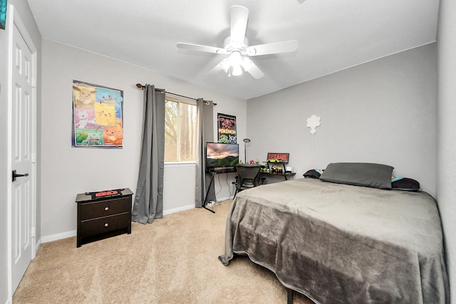 carpeted bedroom with baseboards and ceiling fan